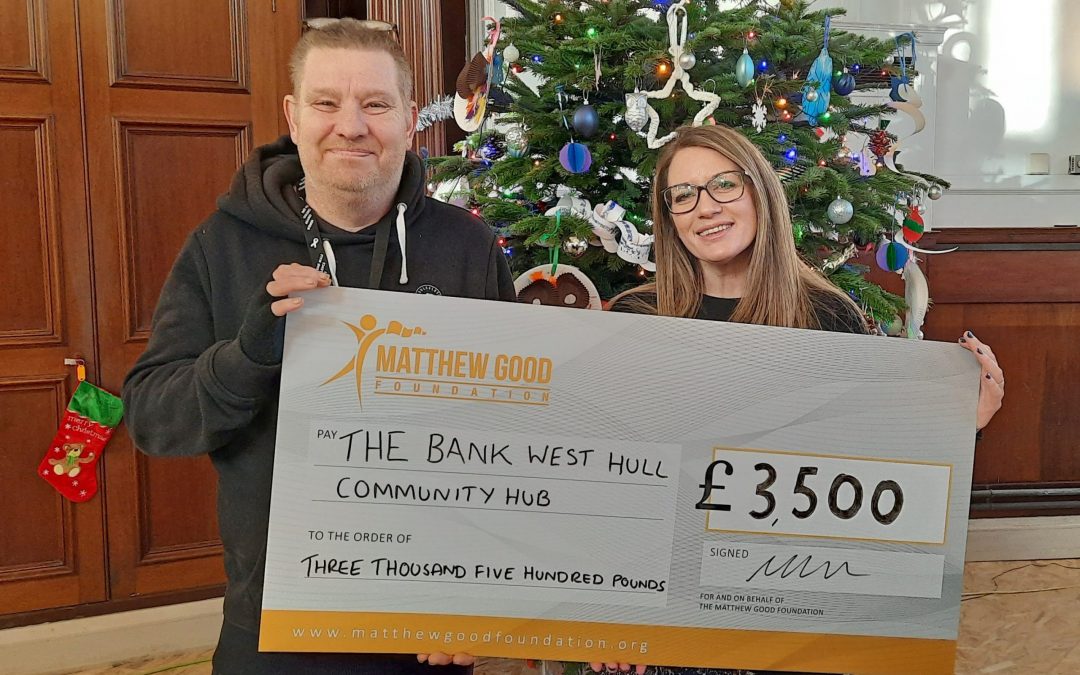 Michelle Taft - Executive Director of The Matthew Good Foundation presents a cheque for £3,500 to Rod Grimmer from The Bank after they won in a Grants For Good vote.