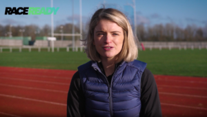 Screenshot of Amy Boalch Talking to the camera from a race track