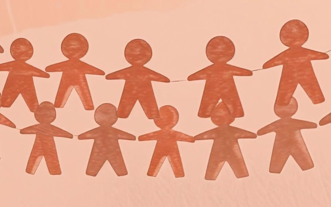 Image of paper doll chain on light orange background