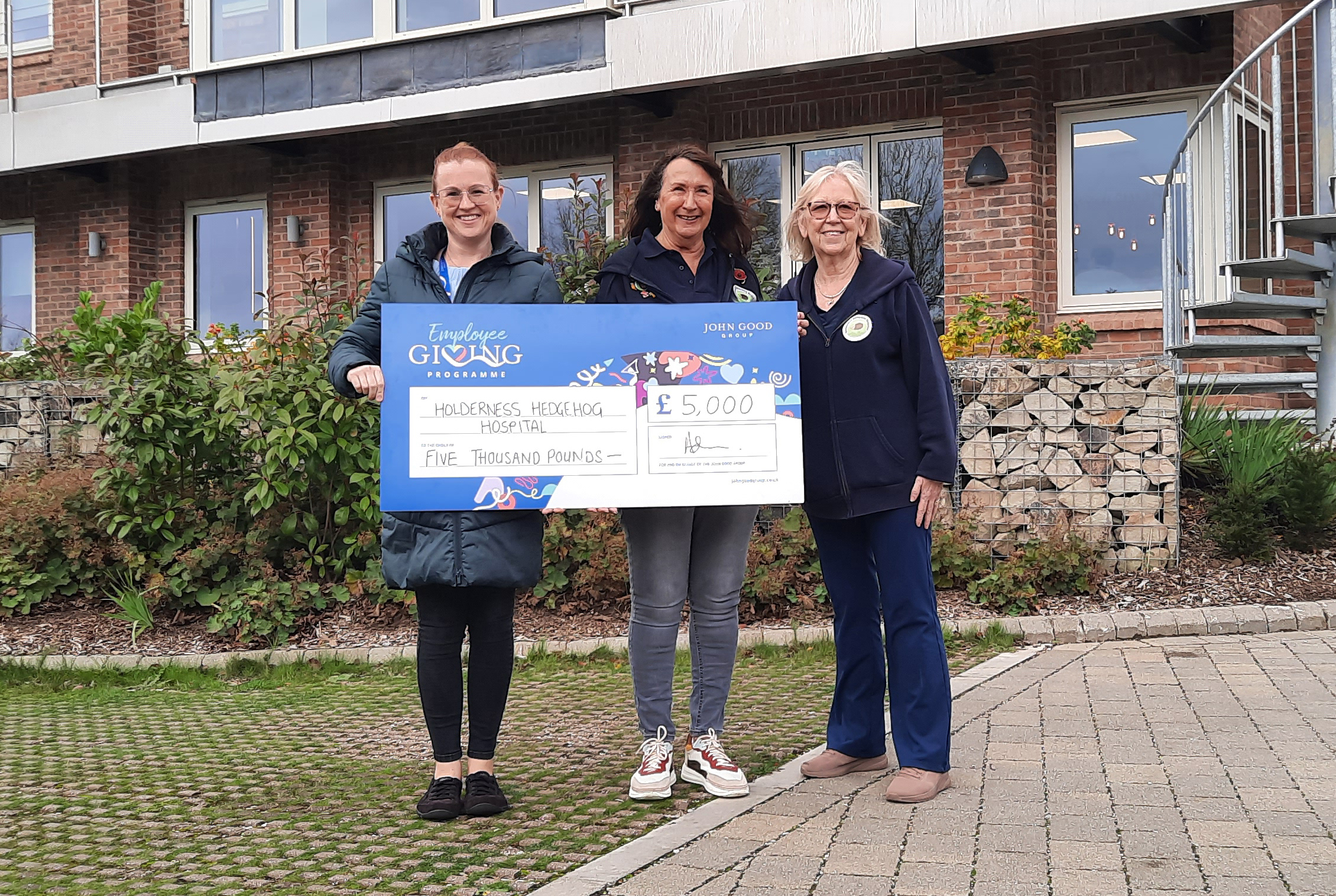 Hedgehog Rescue Hull & East Yorkshire - Kirsty Clark hands a small charity grant to a local small charity - the Holderness Hedgehog Hospital