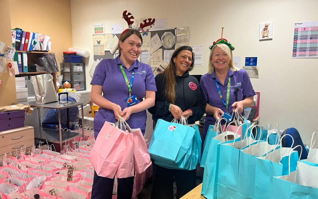 Emmie's Kitchen handing gift bags to staff at Royal Manchester Children's Hospital