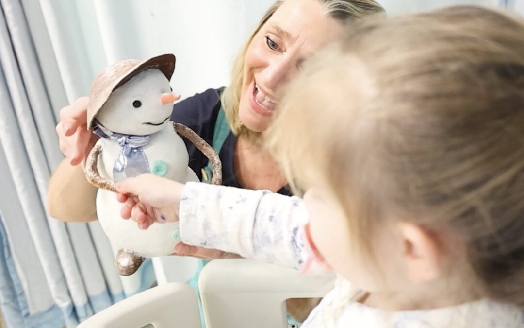 Performance artists entertain young oncology patients as part of a hospital arts programme