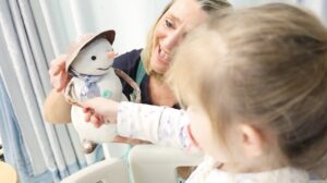 Performance artists entertain young oncology patients as part of a hospital arts programme