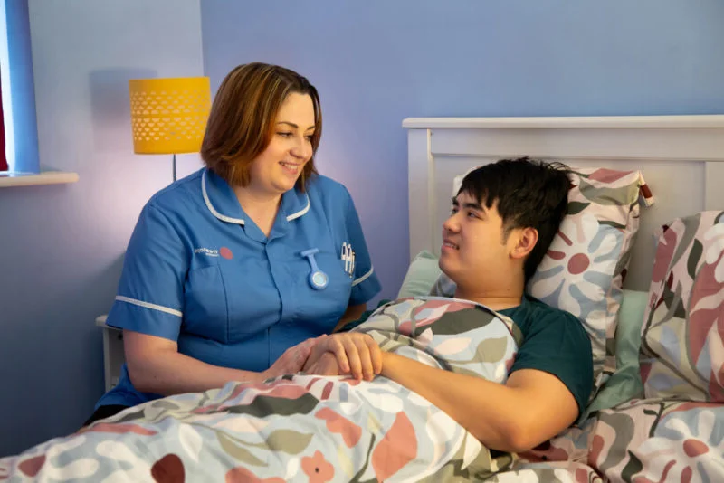 Treetops Hospice nurse offering comfort and support to a patient receiving palliative care