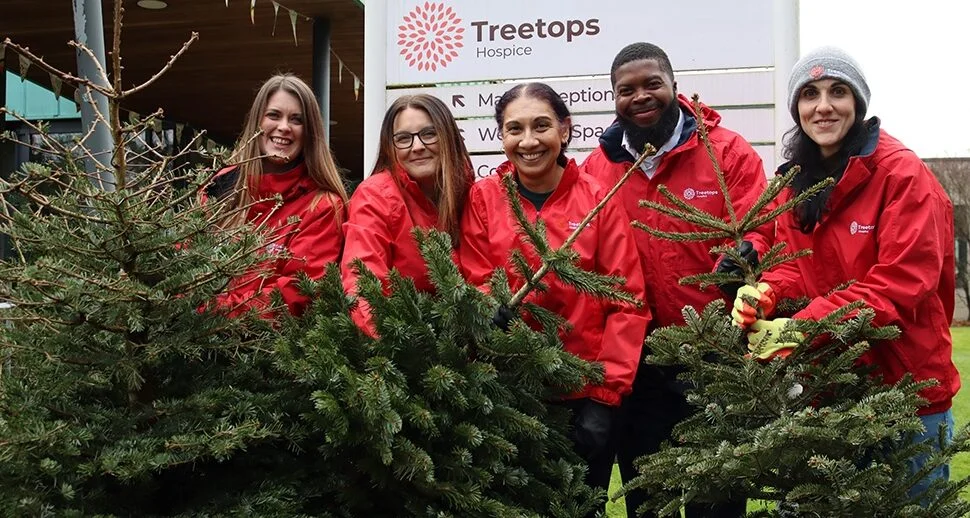 Treetops-Hospice-Treecycling-2024-e1729247176125 Group of Treetops Hospice volunteers supporting community palliative care services