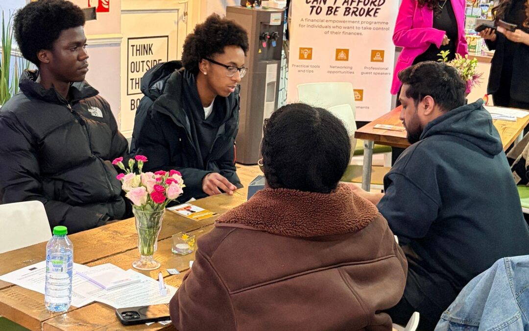 Participants taking part in a money confidence workshop discussion