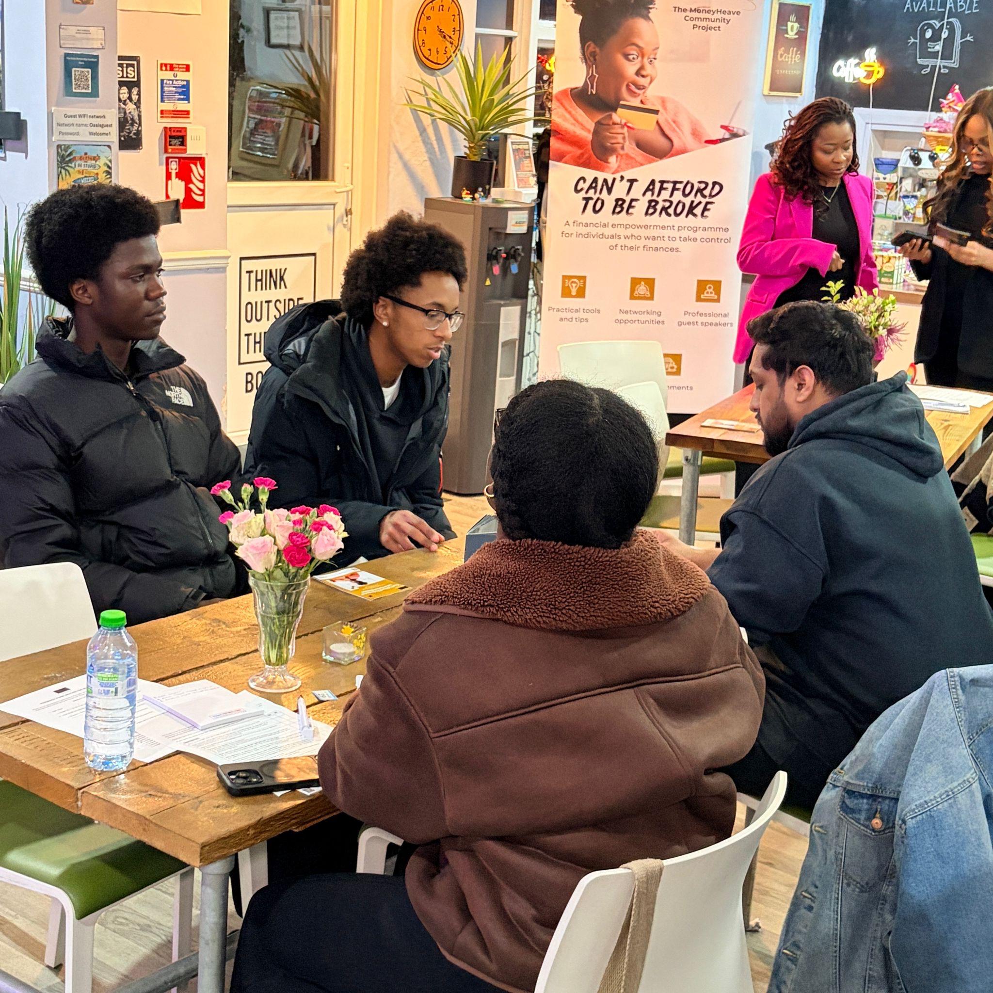 Participants taking part in a money confidence workshop discussion