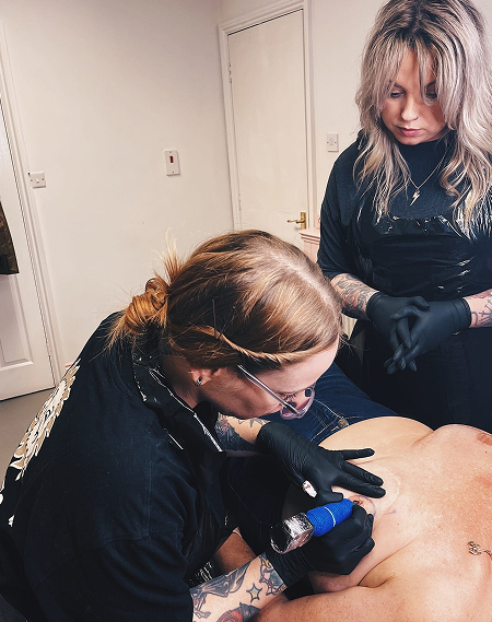 Tattoo artist mastectomy Tattoo artist specialising in mastectomy tattoos working with a client