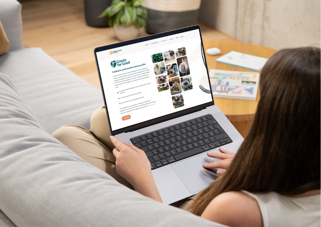 small charity leader researches online for how to write a grant application