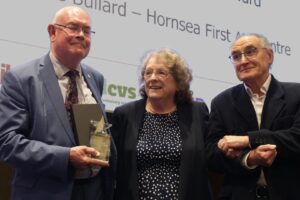 Rosie Bullard Award 2025 Rosie Bullard, supported by her husband as she is handed the Special Recognition award for her work at Hornsea First Aid Centre