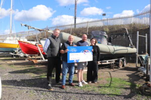 DAN shipping team present Clean Planet - a Yorkshire ghost gear removal service - with a £5,000 cheque